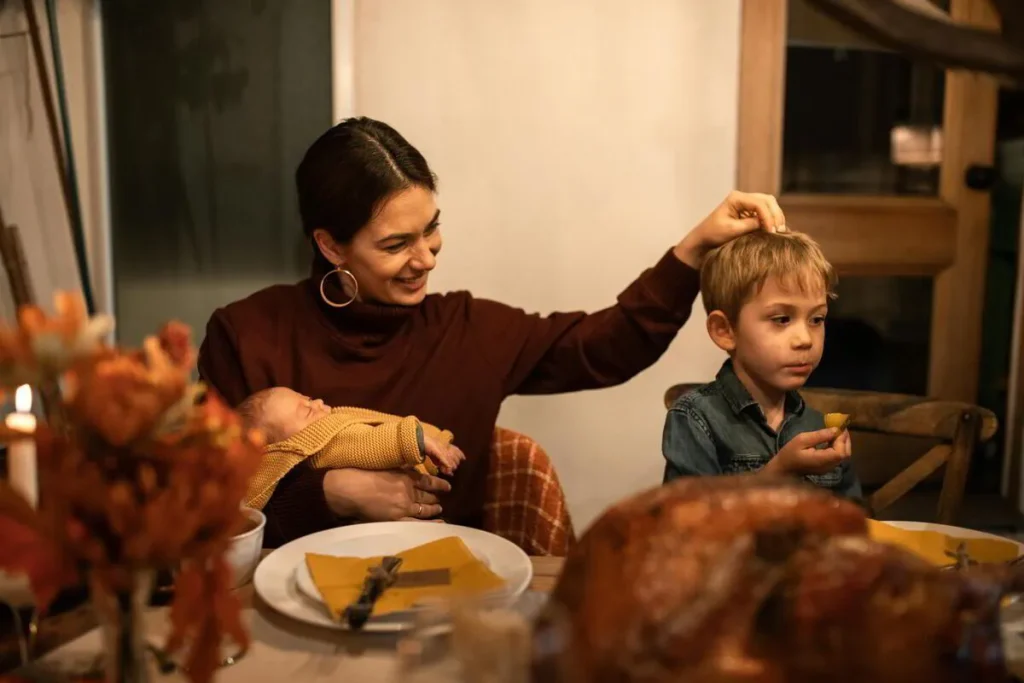 Mother and son at a family roast dinner